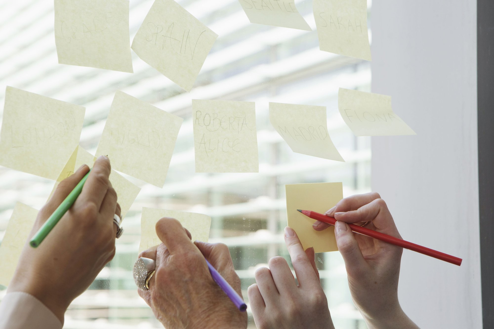 team-brainstorming-with-sticky-notes-on-a-glass-wa-2025-04-05-01-14-45-utc (1)